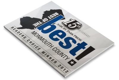 Magazine cover featuring "Best" award badge with New York Press recognition on dental practice publication.