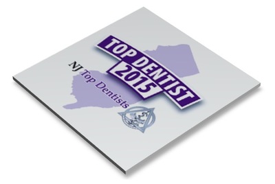 Toddler Dental logo featuring purple text and NJ map outline on white surface.